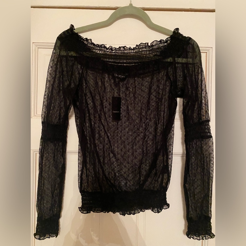 Bebe new black sheer top with tag. Size XS